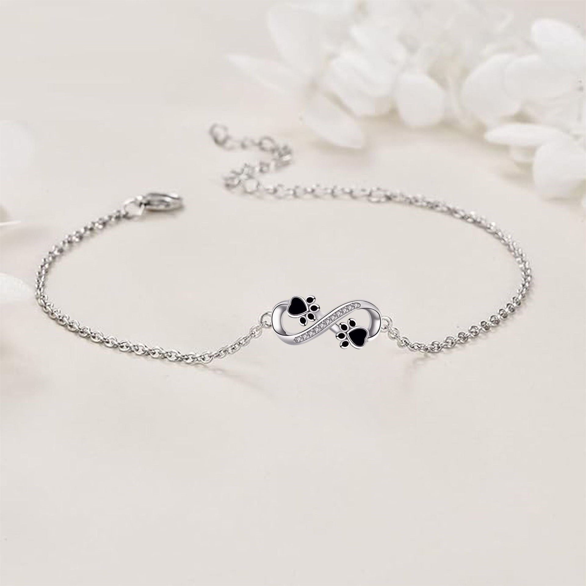Unendliches Symbol Anhänger Haustierpfote Armband mit Zirkonia